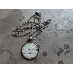 Carrion Swift pendant necklace made from Quicksilver book pages